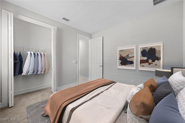 bedroom featuring a closet and light colored carpet