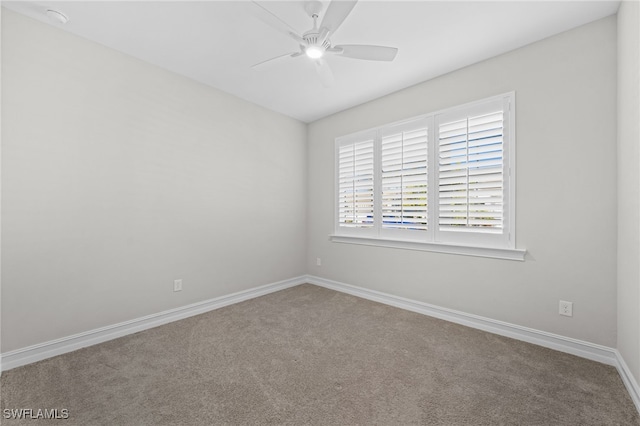 empty room with carpet and ceiling fan