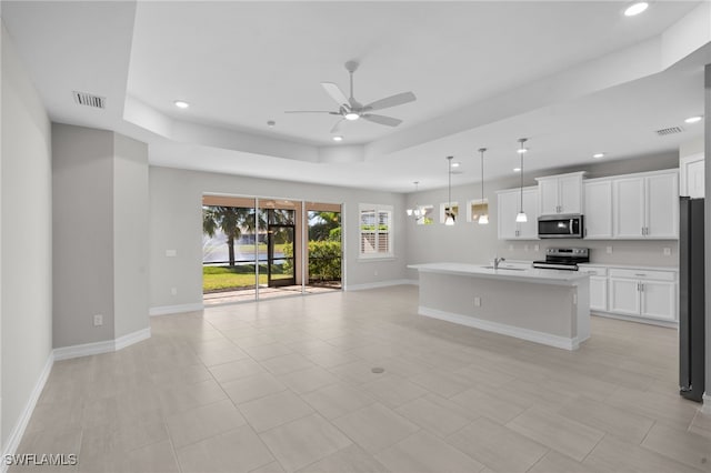 16522 Crescent Beach Way, Bonita Springs, FL 34135 - unfurnished living room featuring a raised ceiling, ceiling fan, a sink, baseboards, and recessed lighting