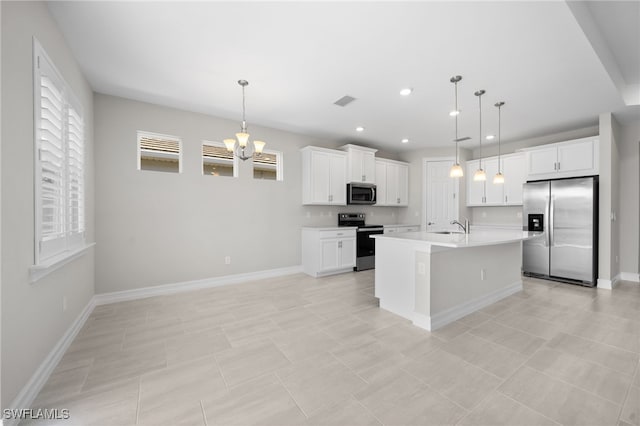 16522 Crescent Beach Way, Bonita Springs, FL 34135 - kitchen featuring stainless steel appliances, plenty of natural light, a sink, a chandelier, and recessed lighting