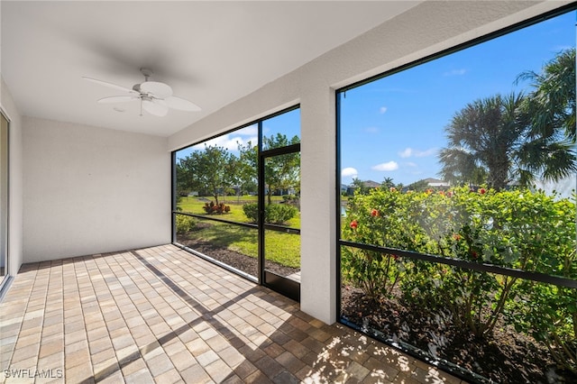 16522 Crescent Beach Way, Bonita Springs, FL 34135 - unfurnished sunroom featuring ceiling fan