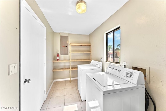 washroom with light tile patterned floors, electric panel, and separate washer and dryer