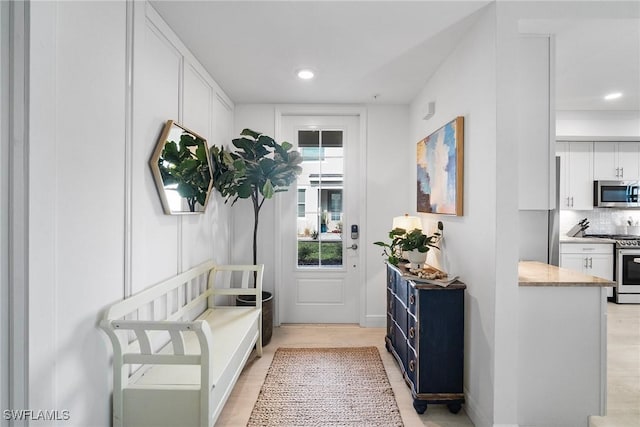 doorway to outside with light hardwood / wood-style floors