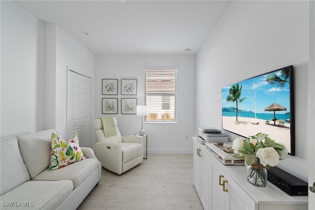 living room with light hardwood / wood-style flooring