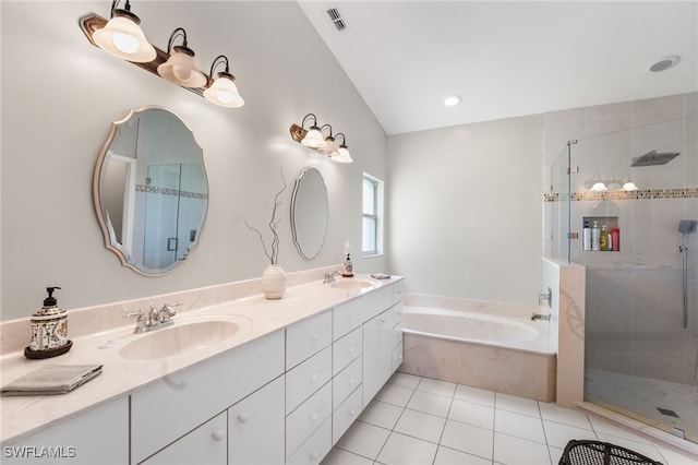 bathroom with plus walk in shower, vanity, tile patterned flooring, and vaulted ceiling