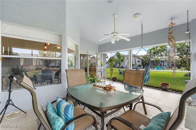 sunroom featuring ceiling fan and lofted ceiling