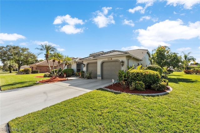 mediterranean / spanish-style home featuring a front lawn and a garage