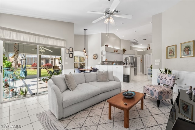 tiled living room with sink and high vaulted ceiling