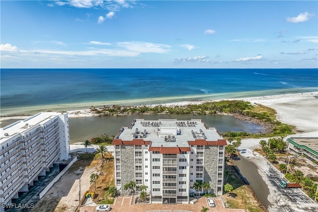 drone / aerial view featuring a water view and a view of the beach