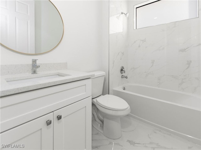 full bathroom with toilet, vanity, and tiled shower / bath