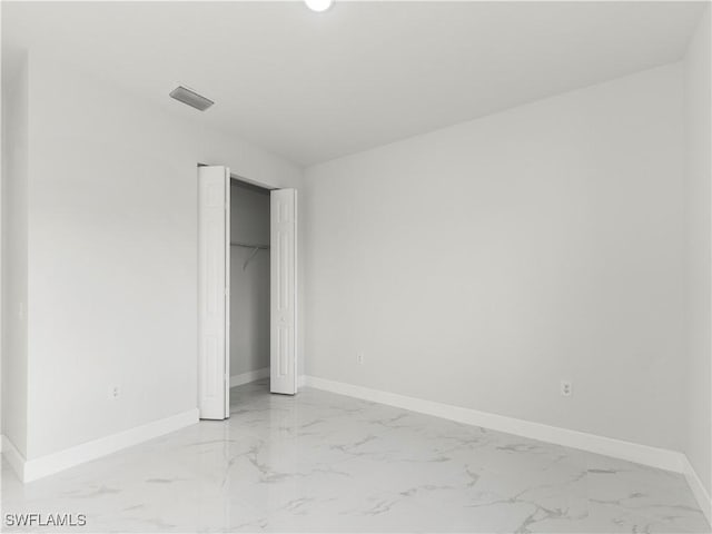 unfurnished bedroom with a closet