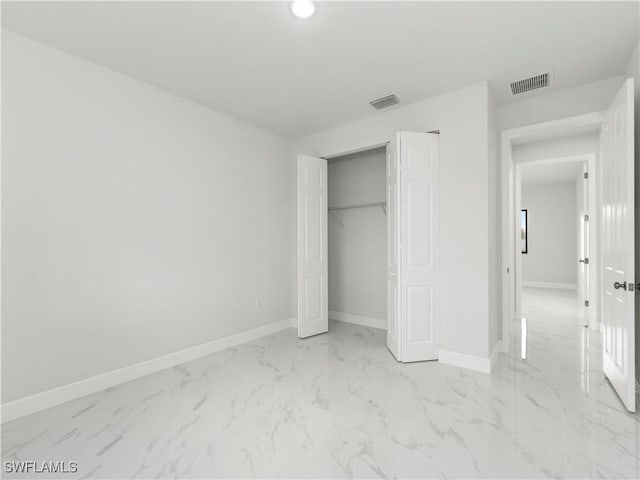 unfurnished bedroom with a closet