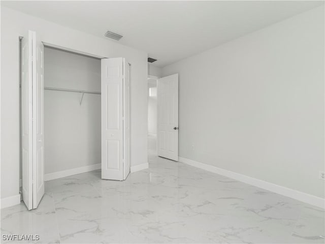 unfurnished bedroom featuring a closet