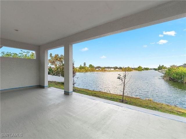 view of patio with a water view