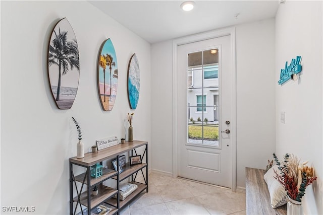 entryway with light tile patterned floors