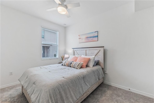 bedroom featuring ceiling fan and light colored carpet