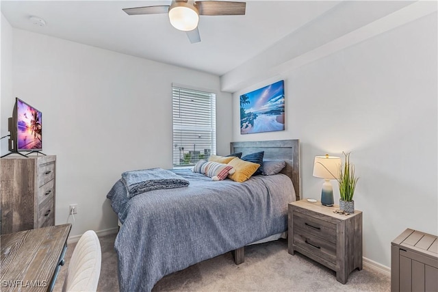 bedroom featuring light colored carpet and ceiling fan