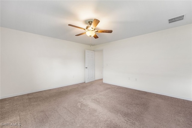 spare room featuring carpet floors and ceiling fan