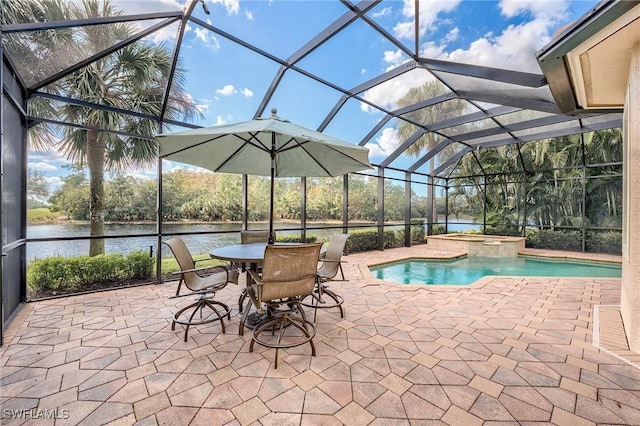 view of swimming pool with a lanai, a patio area, a water view, and an in ground hot tub