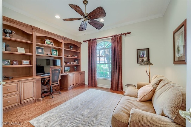 office space with ceiling fan, light hardwood / wood-style flooring, and crown molding