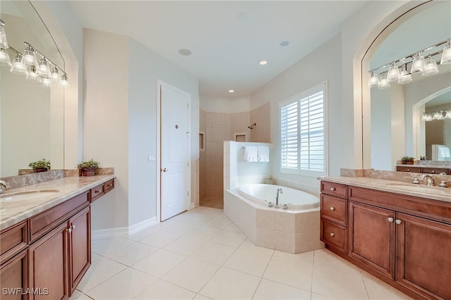 bathroom with tile patterned flooring, vanity, and plus walk in shower