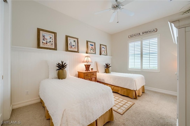 bedroom featuring ceiling fan and light carpet