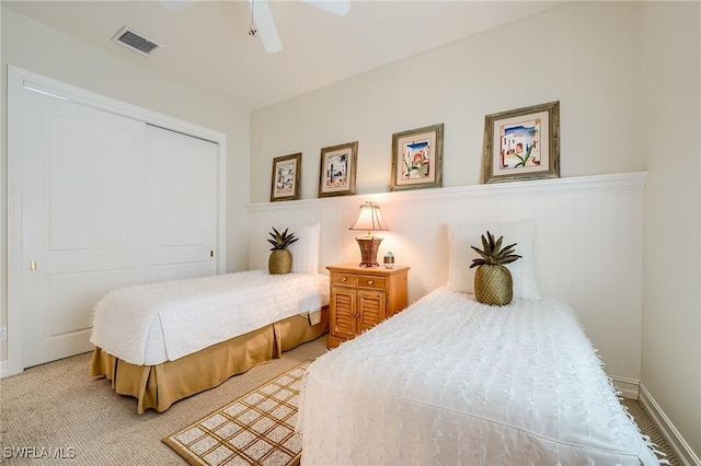 bedroom featuring carpet, a closet, and ceiling fan