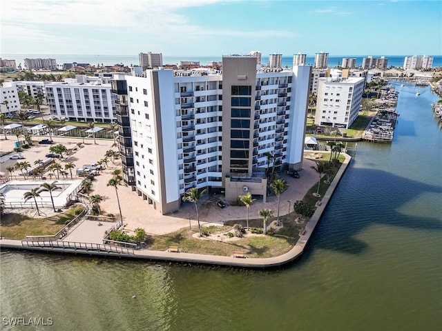 birds eye view of property with a water view