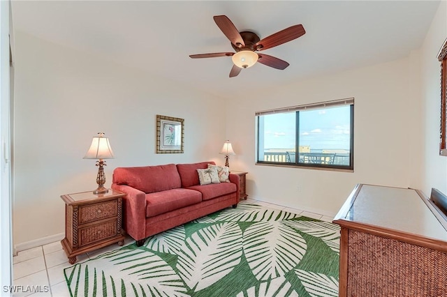 tiled living room with ceiling fan