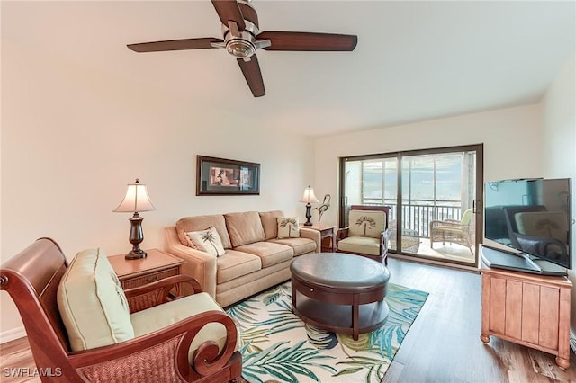 living room with ceiling fan and light wood-type flooring