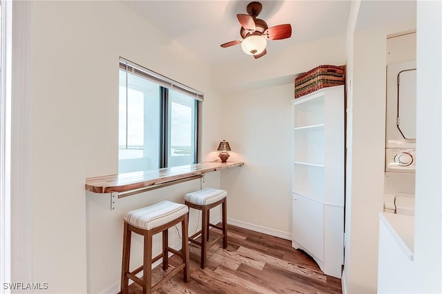 interior space with ceiling fan and light wood-type flooring