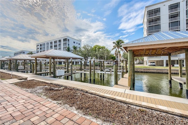 4265 Bay Beach Ln Unit 926, Fort Myers Beach, FL 33931 - dock area featuring a water view and a gazebo