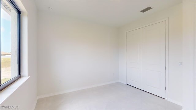 unfurnished bedroom with a closet