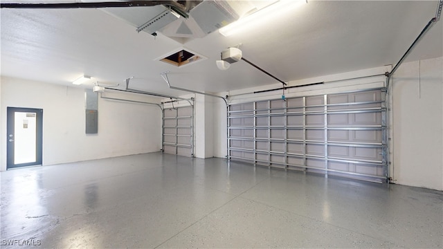 garage featuring a garage door opener and electric panel