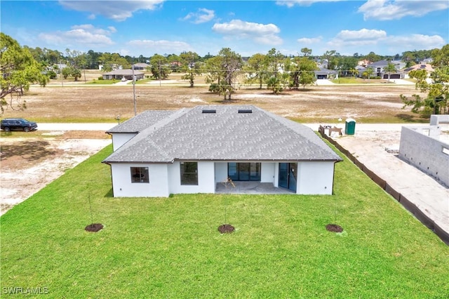 back of house with a yard