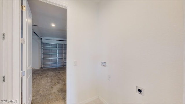 washroom with hookup for an electric dryer