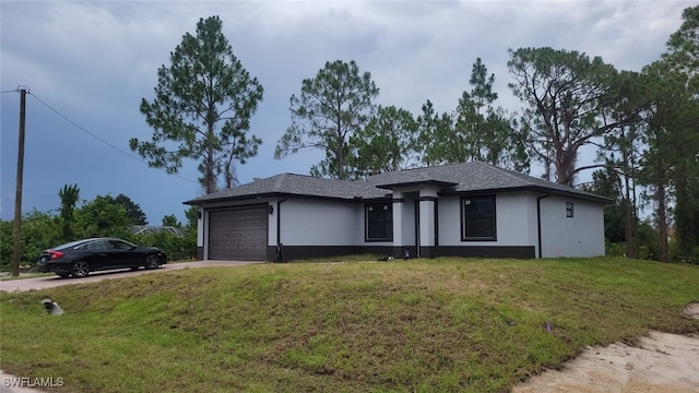 view of front of property with a garage and a front yard