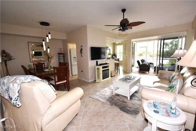 living room with ceiling fan and light tile patterned floors