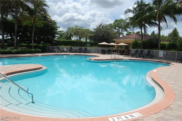 view of swimming pool featuring a patio