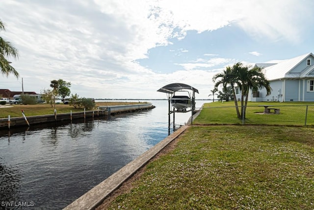 dock area featuring a yard and a water view