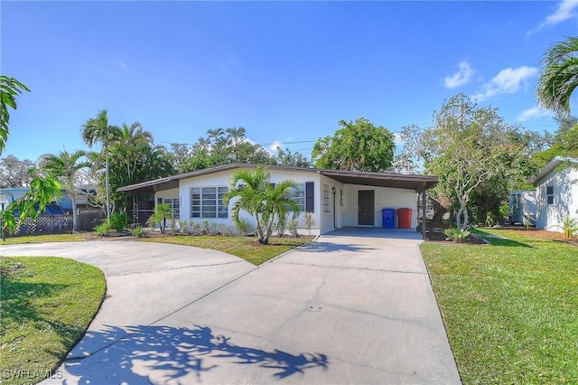 ranch-style home with a front lawn and a carport