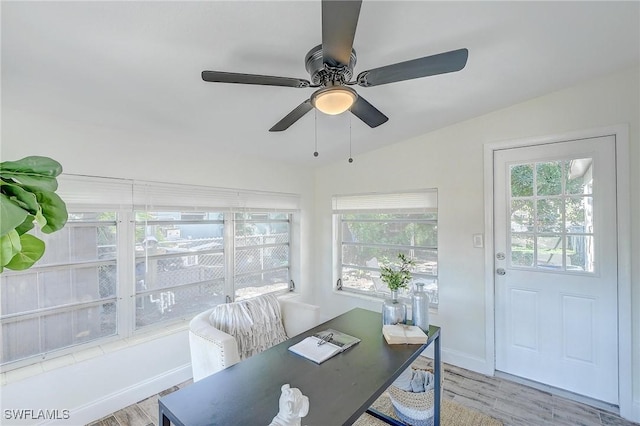 office area featuring a wealth of natural light, ceiling fan, light hardwood / wood-style floors, and lofted ceiling