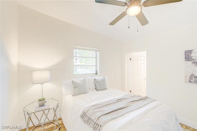 bedroom featuring light wood-type flooring and ceiling fan