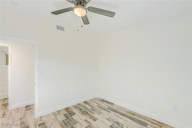 empty room featuring ceiling fan and light hardwood / wood-style floors