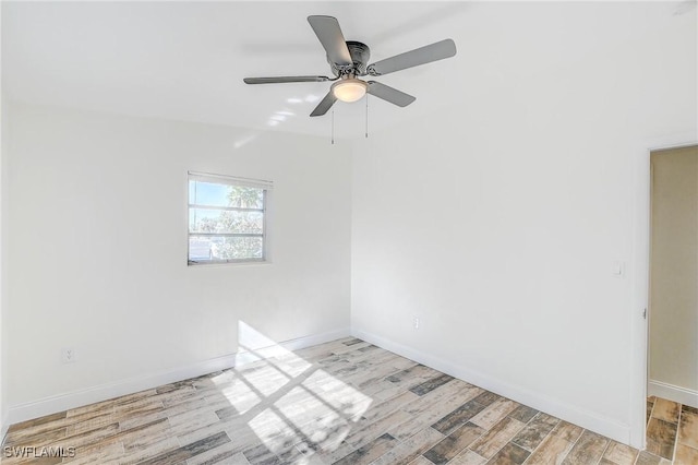 spare room with light hardwood / wood-style floors and ceiling fan