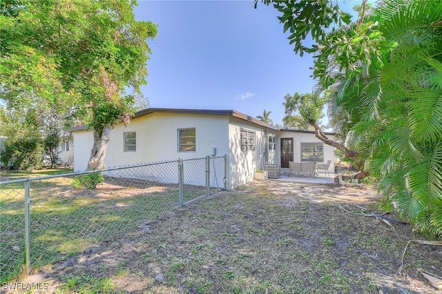 rear view of house with a patio area