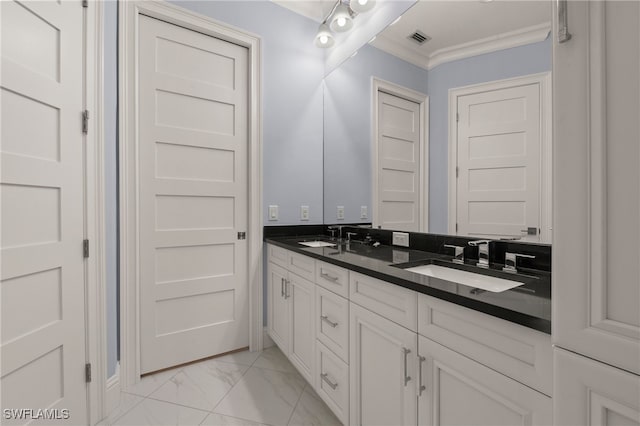 bathroom with crown molding and vanity