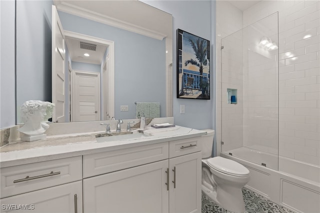 full bathroom with vanity, toilet, ornamental molding, and tiled shower / bath