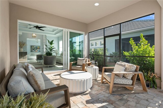 sunroom / solarium with ceiling fan