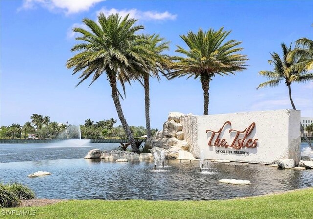 community / neighborhood sign featuring a water view